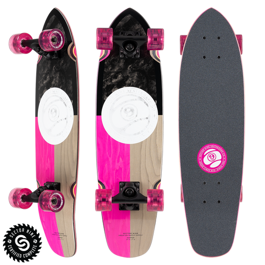 Sector9 Hopper Divide longboard complete, three views with a split pink and natural bottom, a white circle graphic and pink wheels